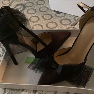 Size 5 high heels with satin bows.